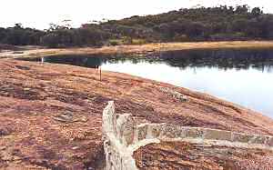Wave Rock concrete wall directs water to reservoir