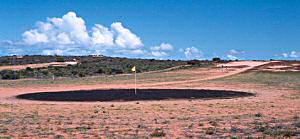 Black 'greens' at Denham golf course